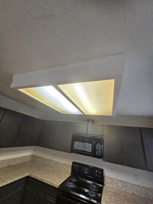 Old lighting with broken covers and mismatched bulb